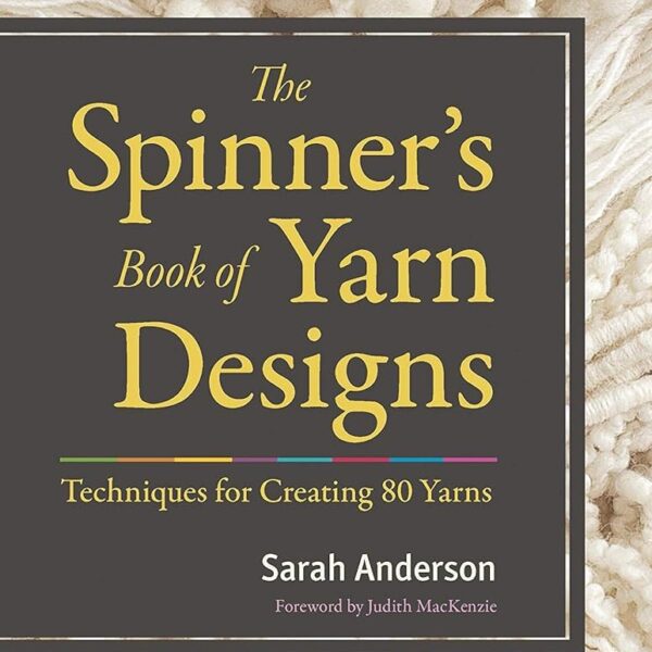 Photo of part of book cover with the text "The Spinner's Book of Yarn Designs"