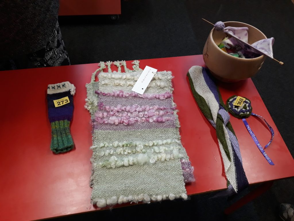 Mittens, scarves and knitted rosette