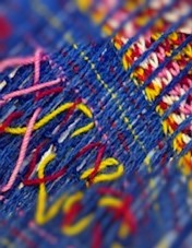 Closeup of colourful fabric -blue, pink, yellow