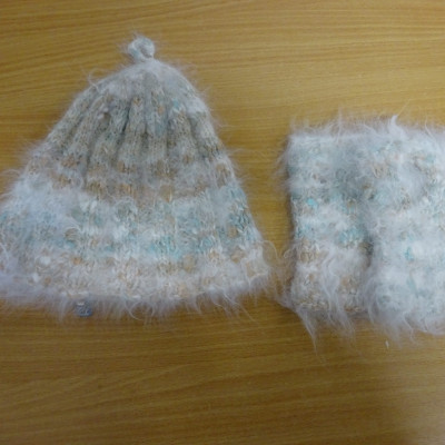 Cream fluffy bobble hat and fingerless mitts.
